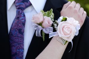 Hands of date Prom night flowers corsage